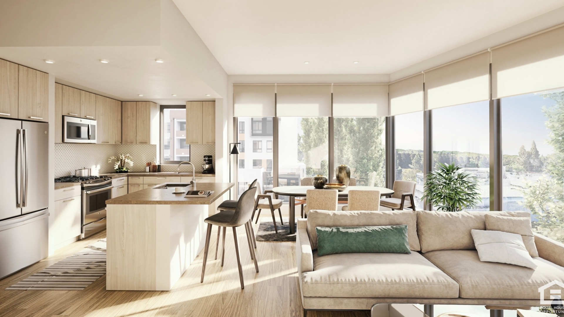 An image of a kitchen and living area with windows and sunlight